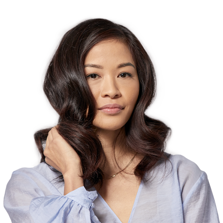 model with long wavy hair showing off her hair color